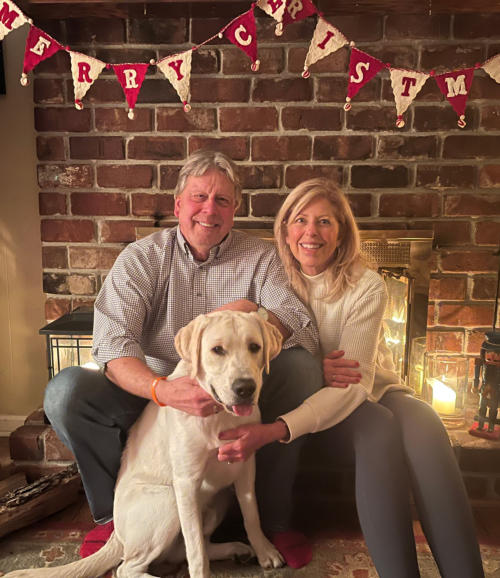 Attorney Tim Pickell, loving wife, and family dog